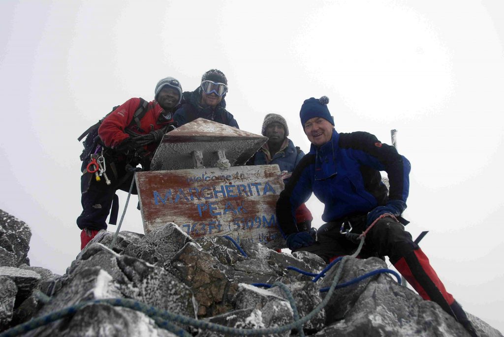 Climbers at Margherita Peak of Rwenzori Mountains, part of great Rwenzori climbing adventure.
