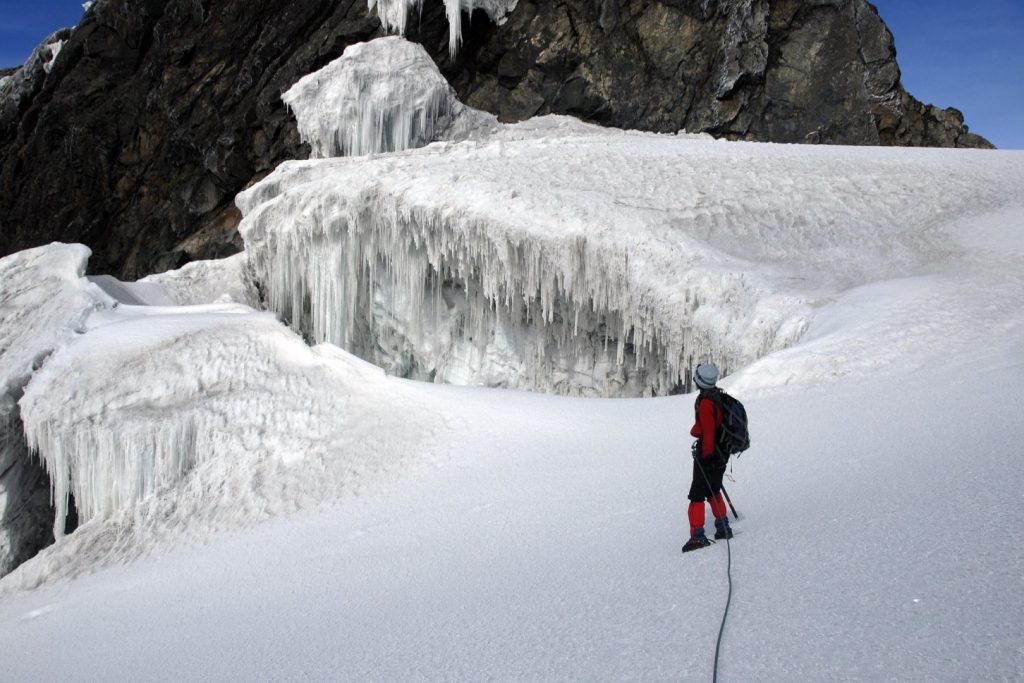 Hiking to the peak of Rwenzori Mountain in Uganda on your Rwenzori mountain hiking safari.