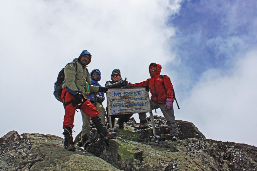 A rewarding moment atop Mount Speke, one of the peaks of Rwenzori mountain ranges